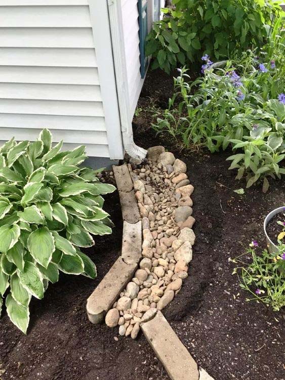 A Small Dry Creek By Using Pebbles #downspout #landscaping #rocks #decorhomeideas