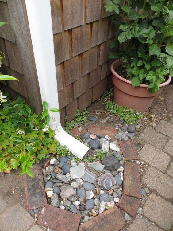 Pebbles and Bricks Are Waiting For A Little Rain #downspout #landscaping #rocks #decorhomeideas