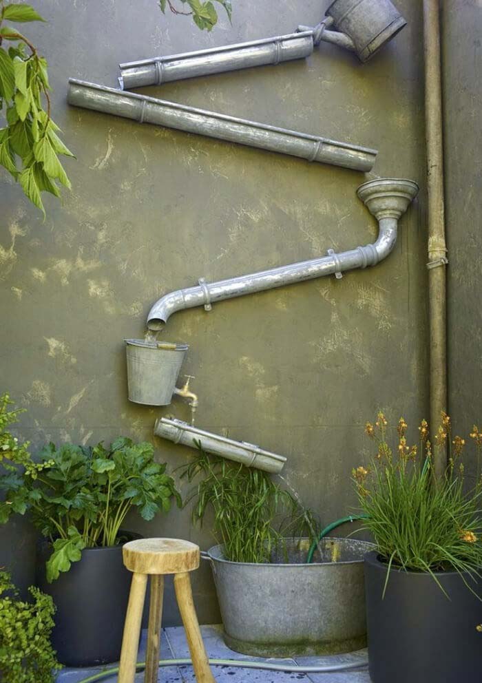 Repurposed Watering Cans For Downspout For Gutters #downspout #landscaping #rocks #decorhomeideas