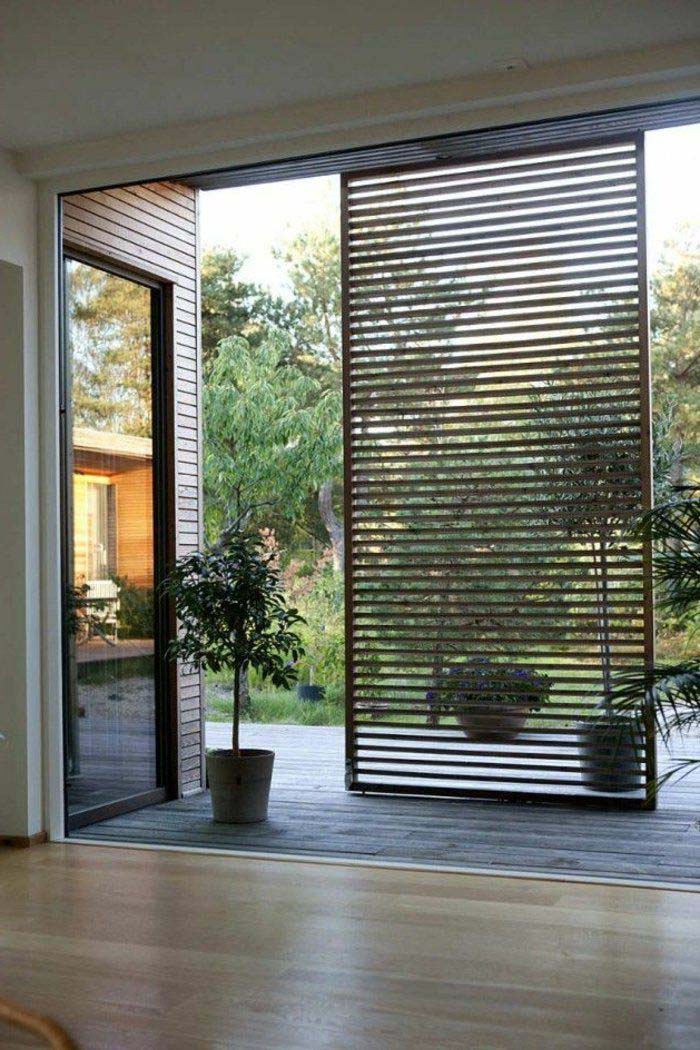 Slat Partition Divides Indoors From Outdoors #woodenslats #homedecor #decorhomeideas