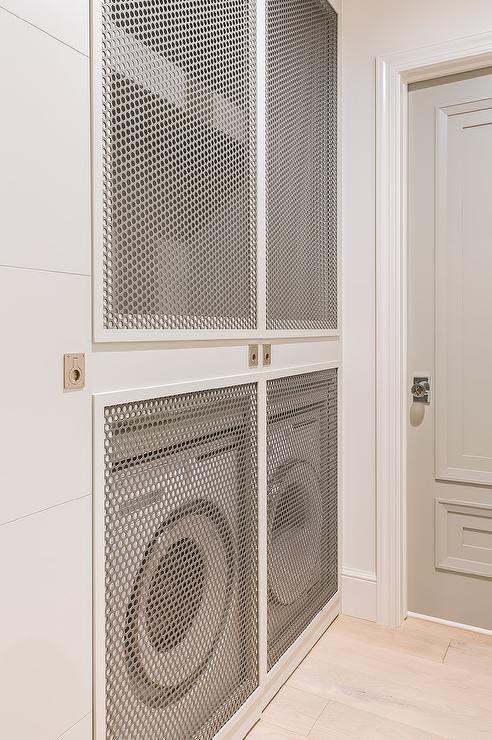 Stacked Washers and Dryers with Metal Grate Doors #laundry #closetdoors #decorhomeideas