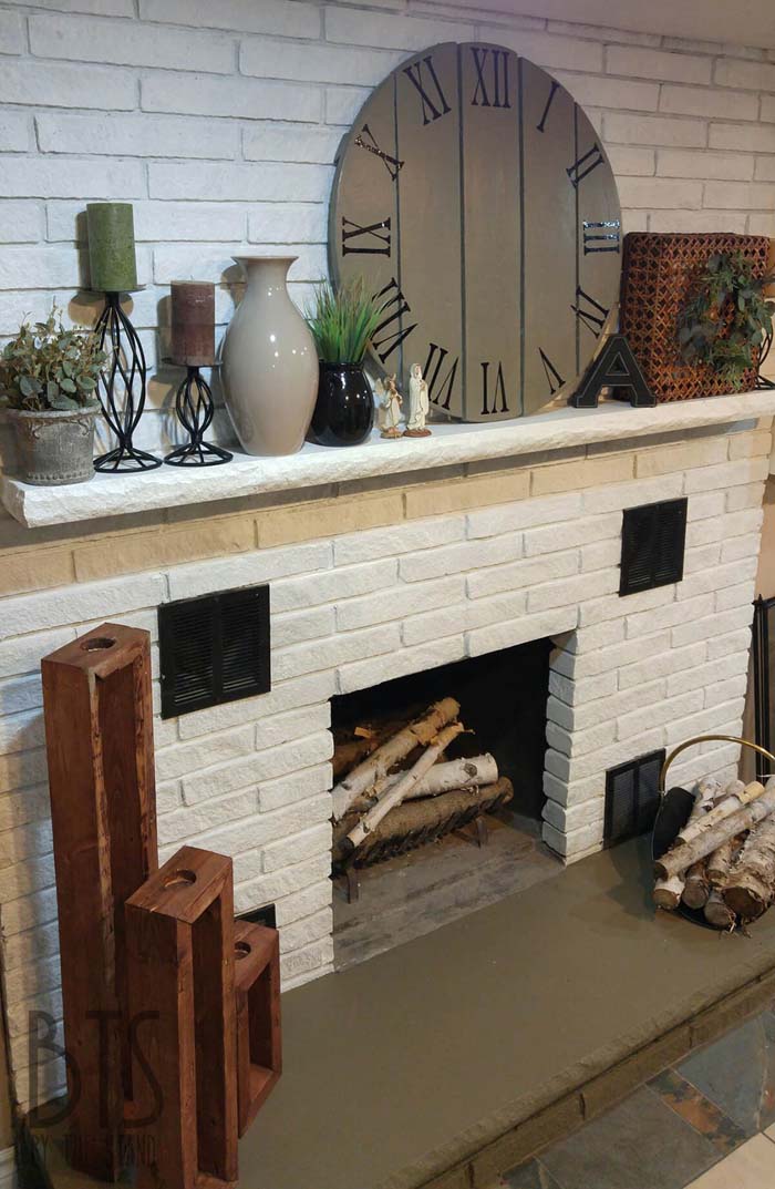 Abundantly Accessorized Mantel on White Fireplace #fireplace #design #decorhomeideas