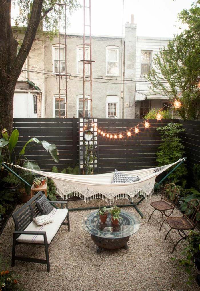City Backyard with Hammock and Benches #outdoorlivingspaces #decorhomeideas