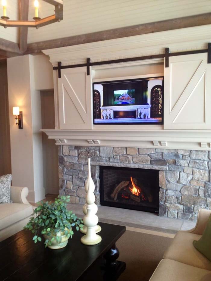 Fitted Field Stone Topped with Barn Doors #fireplace #design #decorhomeideas