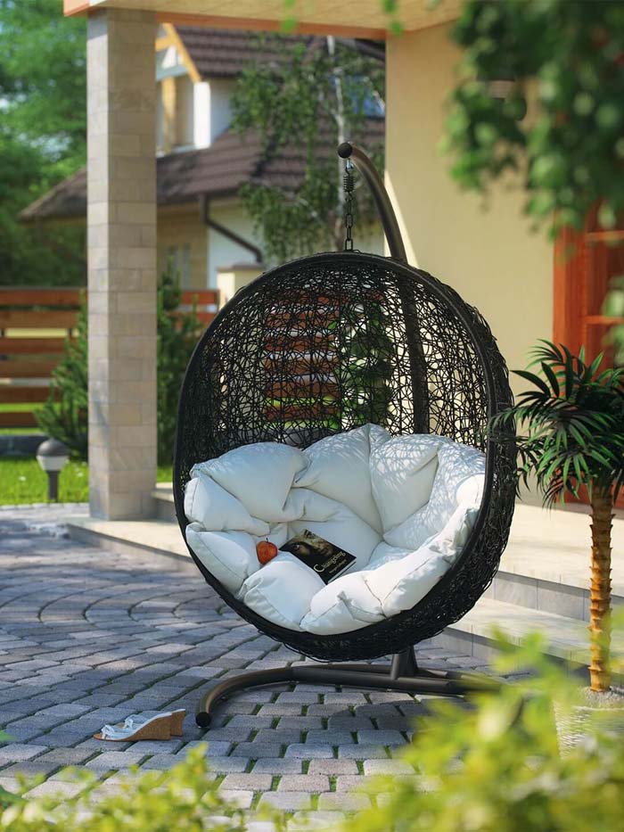 Hanging Egg Chair with Inviting Cushions #outdoorlivingspaces #decorhomeideas