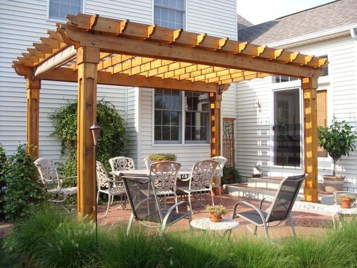 Lovely Arbor over Wrought Iron Furniture #outdoorlivingspaces #decorhomeideas