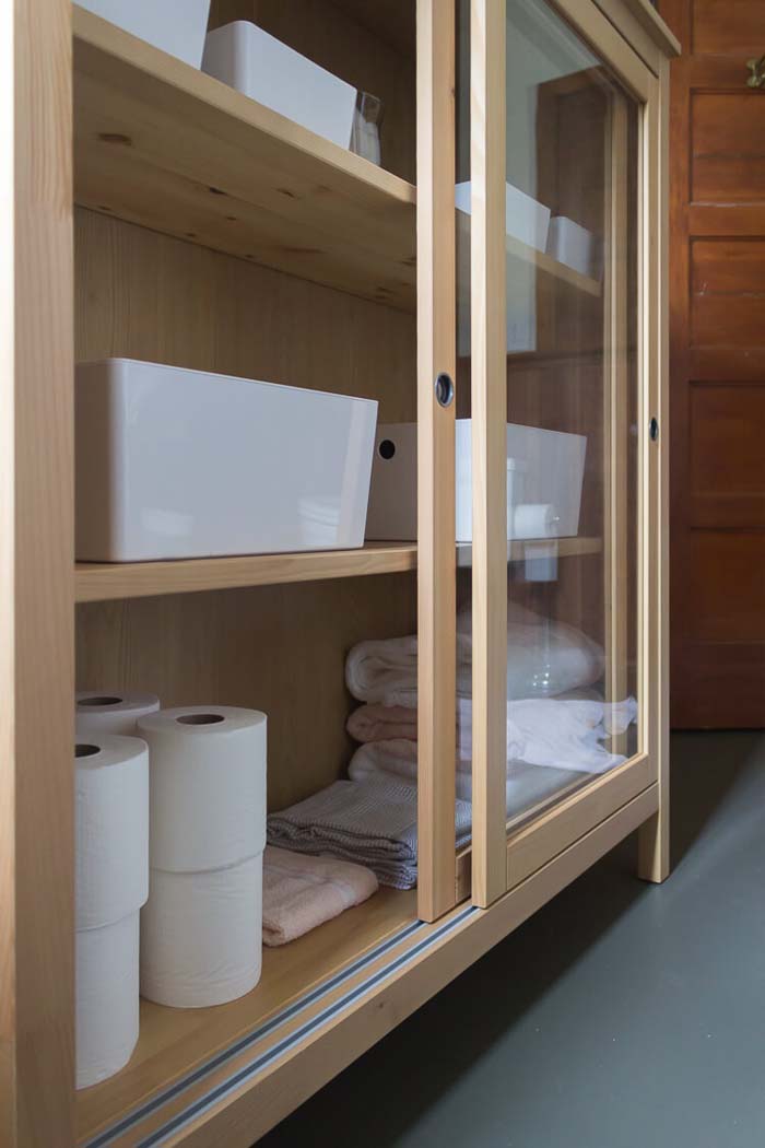 Raw Wood Cabinet with Sliding Glass Doors #storageideas #smallbathroom #decorhomeideas