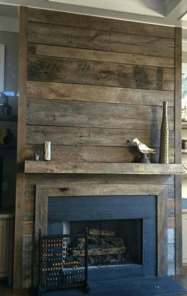 Recycled Farmhouse Wood Creates Unique Fireplace #fireplace #design #decorhomeideas