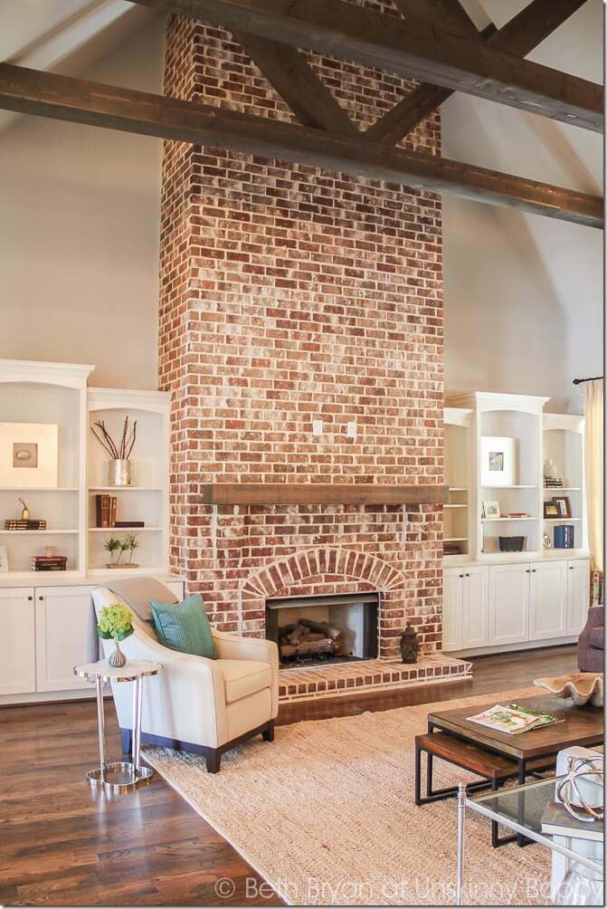 Red Brick Anchors a Tall Space #fireplace #design #decorhomeideas