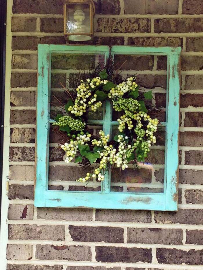 A Frame Beautifies A Brick Wall #oldwindows #repurpose #decorhomeideas