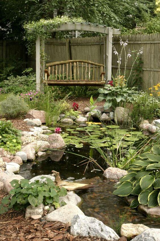 A Natural Rock Pond With Pergola Design Creates A Cottage Garden Style #rocks #garden #decorhomeideas