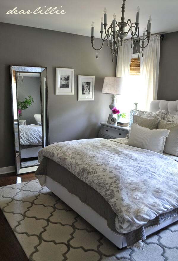 Charming Patterns and Fresh White Accents Adorn a Solid Grey Base Bedroom #greybedroom #decorhomeideas