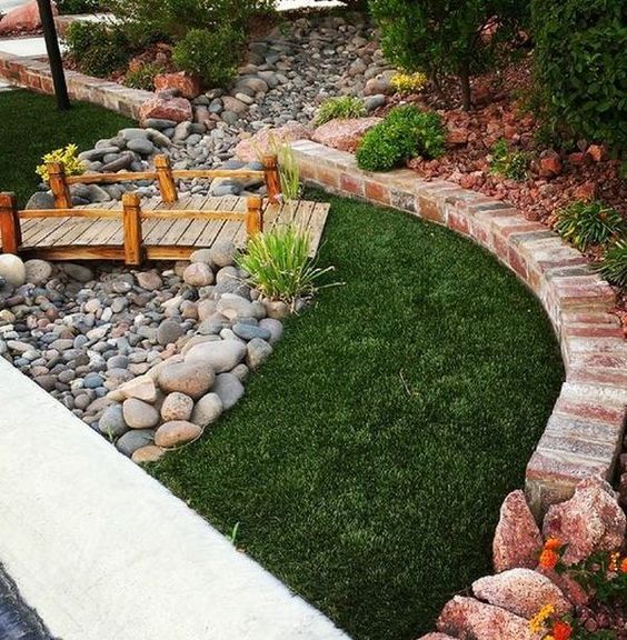 Garden Planted Around a French Drain #dryriverbed #drycreek #decorhomeideas