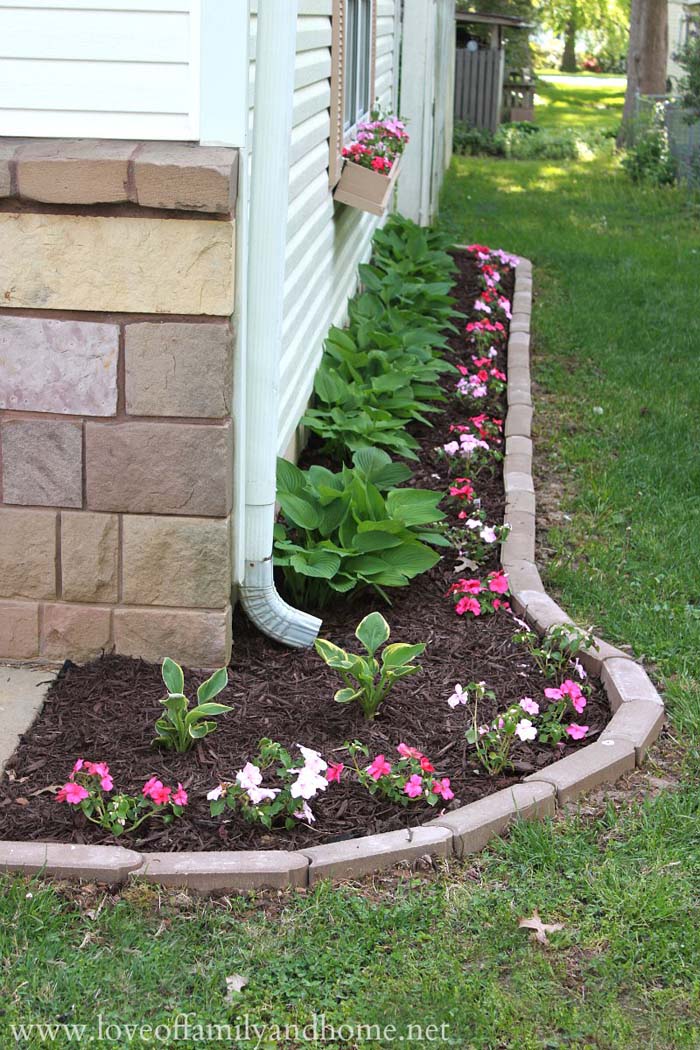 Mulch Used With a Downspout #blackmulch #landscaping #decorhomeideas