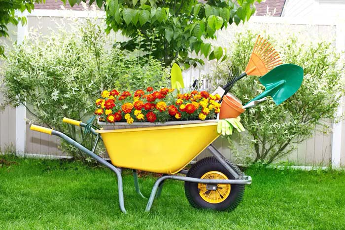 A Bright Yellow Wheelbarrow Planter #decorhomeideas