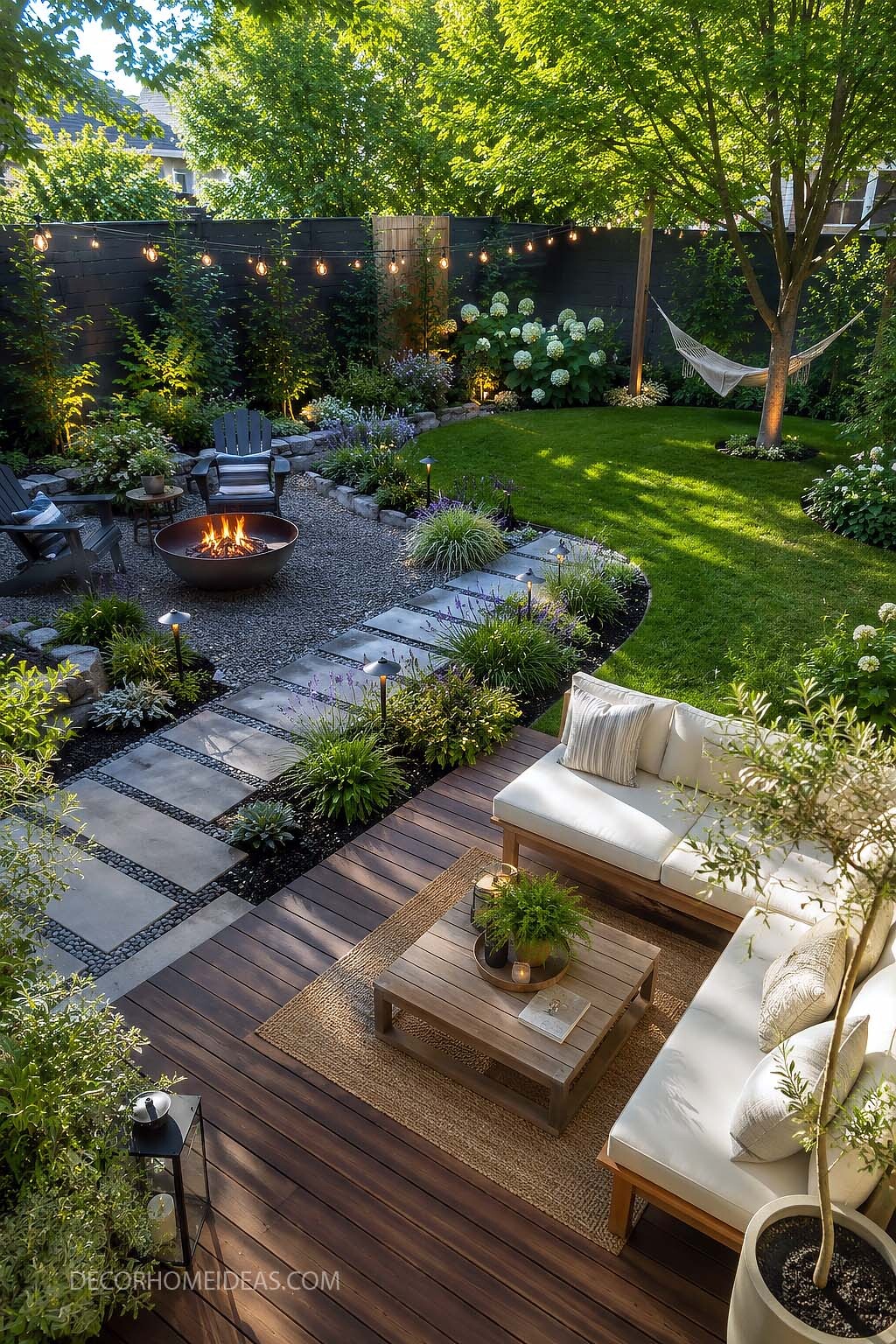 Cozy Backyard Retreat with Deck Seating, Fire Pit and String Lights