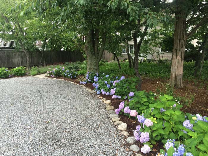 Crushed Gravel Driveway Lined With River Rocks