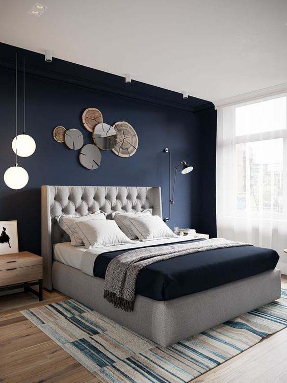 Modern Navy Blue Bedroom With Rustic Wall Art