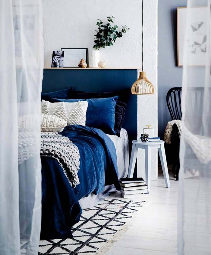 Airy White Interior With Navy Bed Set