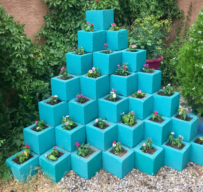 A Pyramid Garden With Blue Cinder Blocks