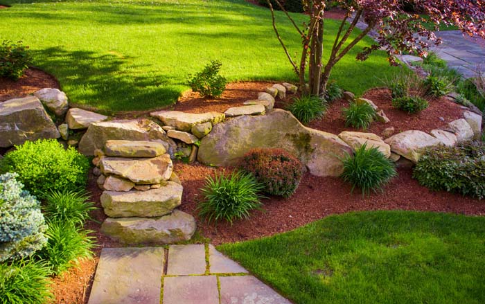 Red Mulch on a Sloped Yard