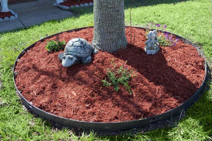 Spread Red Mulch Around a Tree Trunk