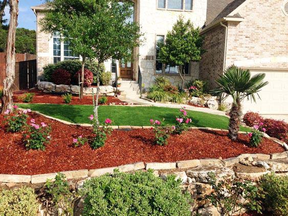 Use Red Mulch on Garden's Retaining Wall