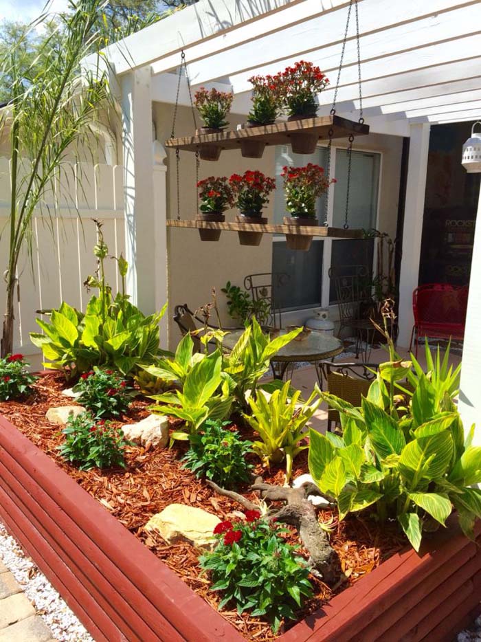 Raised Garden Bed With Red and Brown Mulch