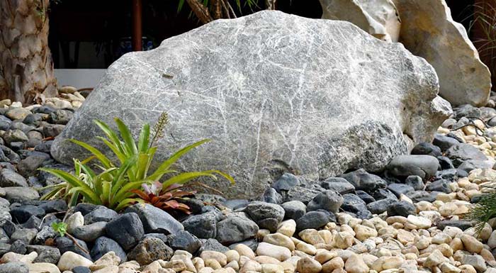 Surround Boulders With Pebbles or Gravel