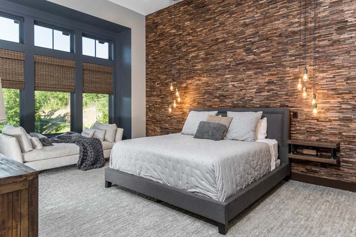 Elegant Bedroom With A Stone Veneer Accent Wall