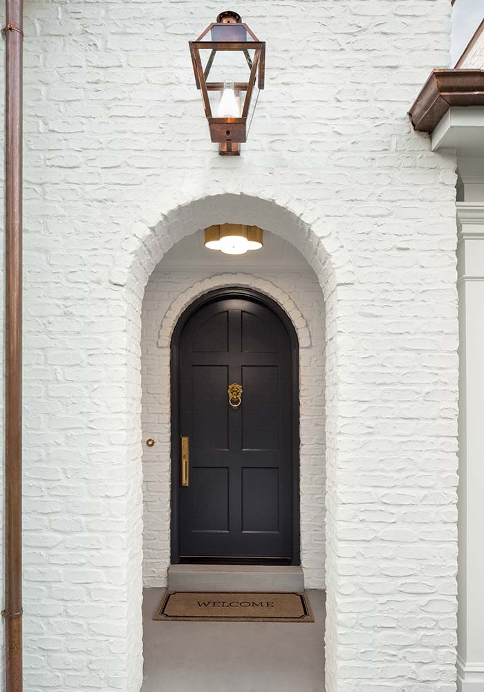 black front door red brick house