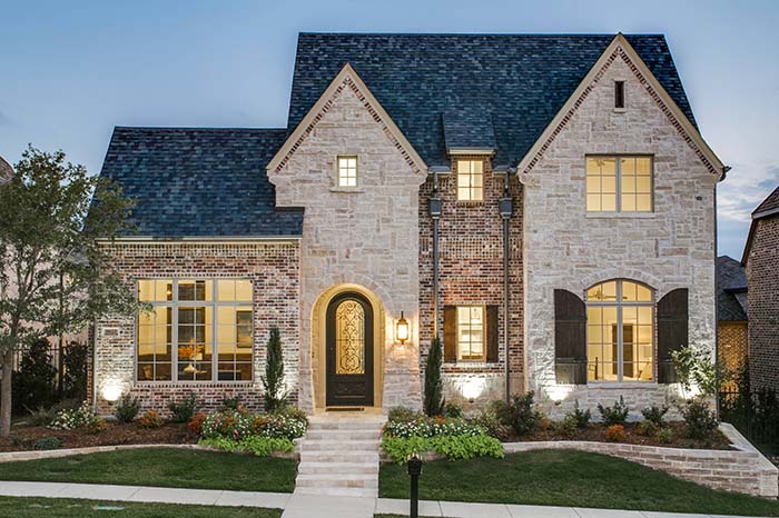 brown front door earth tone brick house