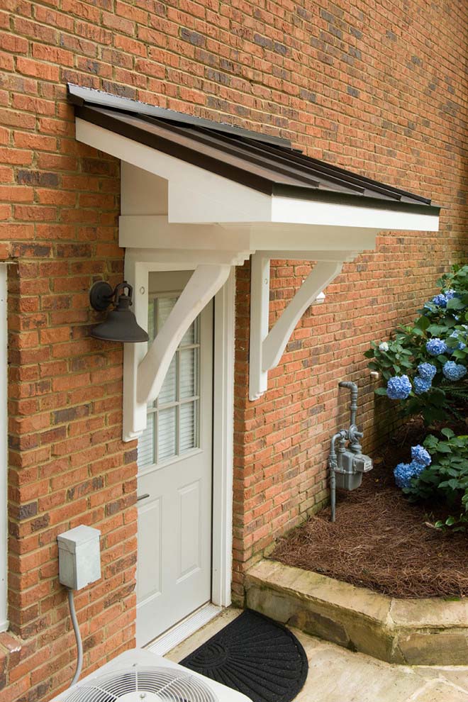 grey front door orange brick house