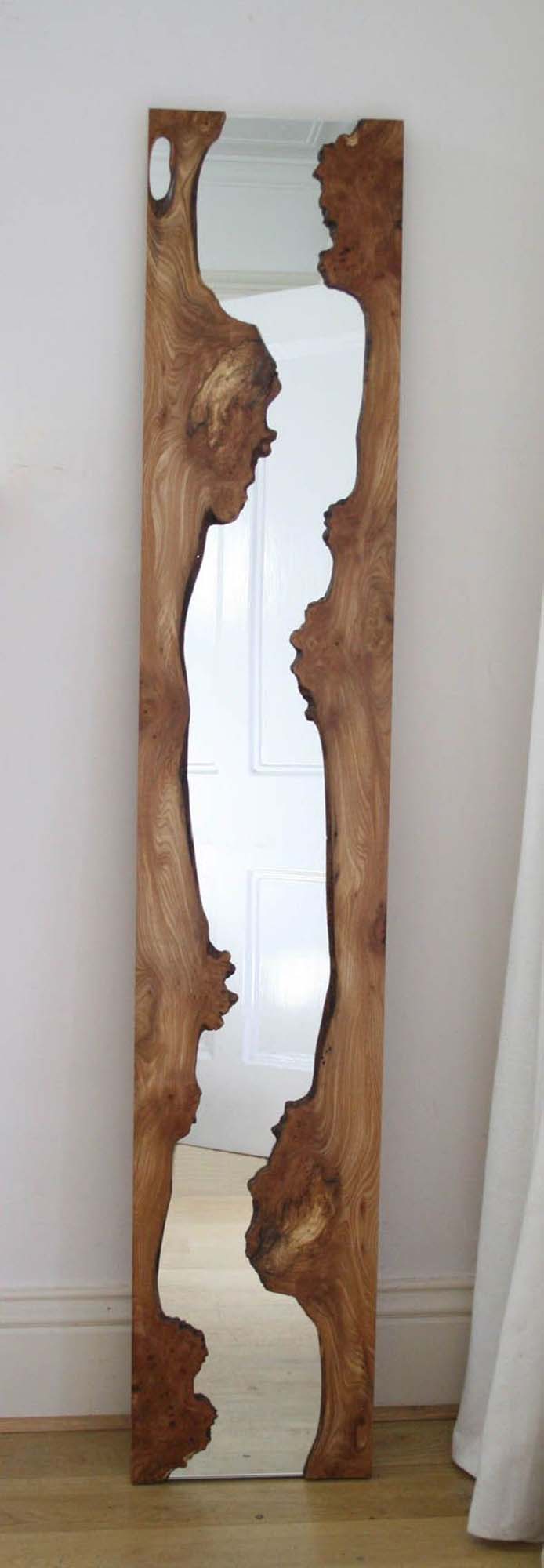 A Mirror Enclosed By A Trunk Slice