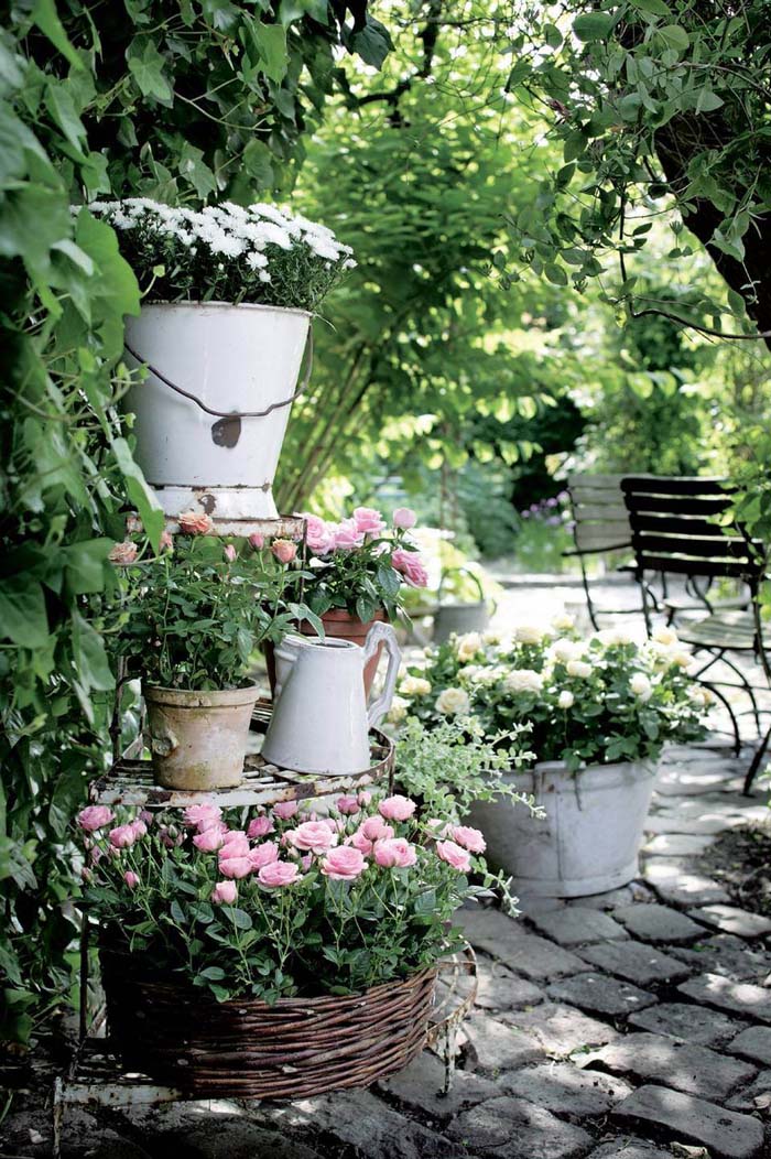Watering Containers Repurposed Into Flower Pots