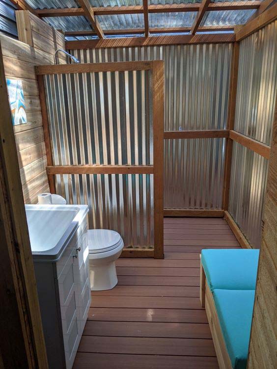 Tin Bathroom Structure With Wood Supports
