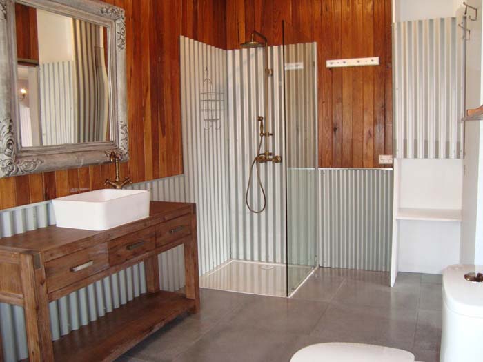 Enclosed Shower Nook With Corrugated Zinc And Glass
