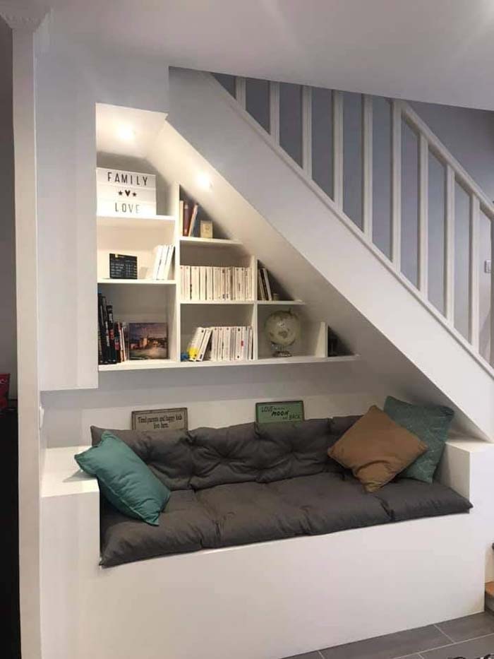 Under-The-Stairs Nook With A Bookshelf And A Sofa