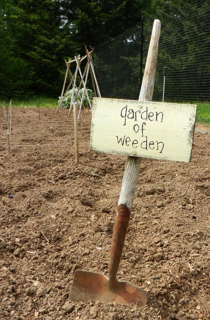 A Wood Sign On An Old Shovel