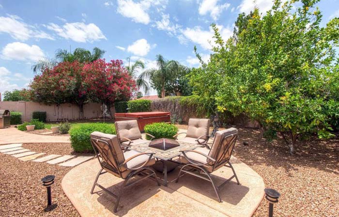 Gravel Outdoor Space With Raised Stone Patio