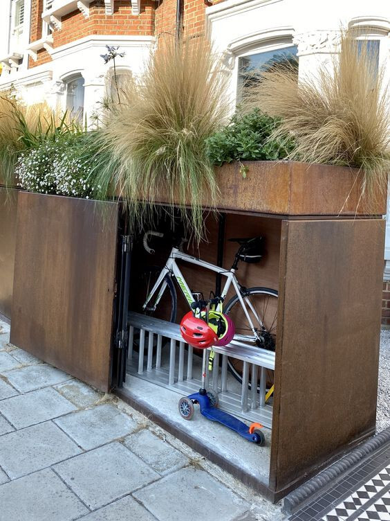 A Bike Storage Under A High Planter Bed