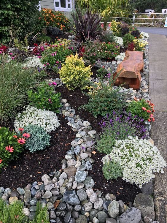 A Small Rock Garden with Colorful Groundcover Flowers