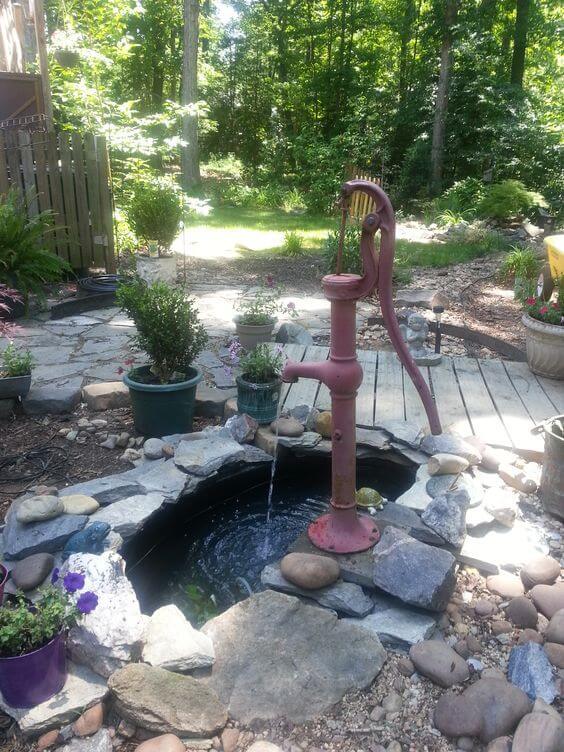 Old Well Pump Water Feature With Small Pond