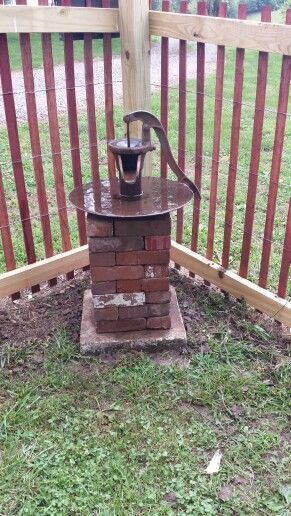 Recycled Brick, A Disk Blade And An Old Pump Makes A New Bird Bath.