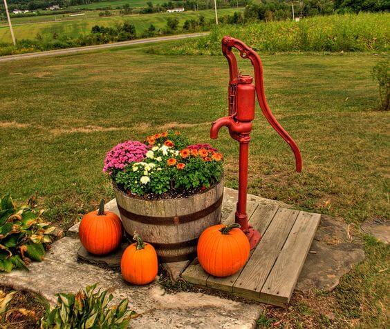 Red Pump With Barrel Planter