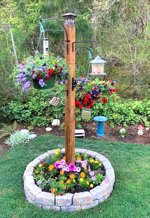 hanging planters on a wooden post