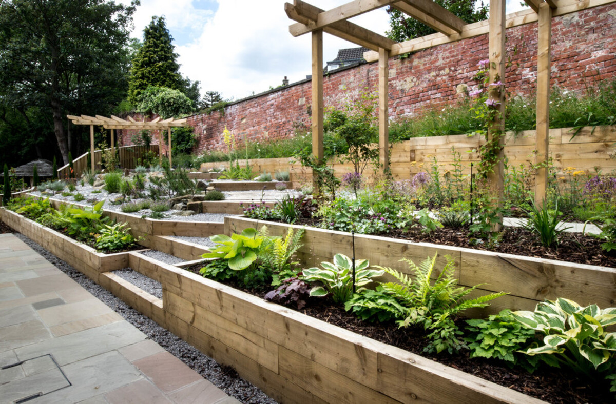 15 raised flower beds along fence 12