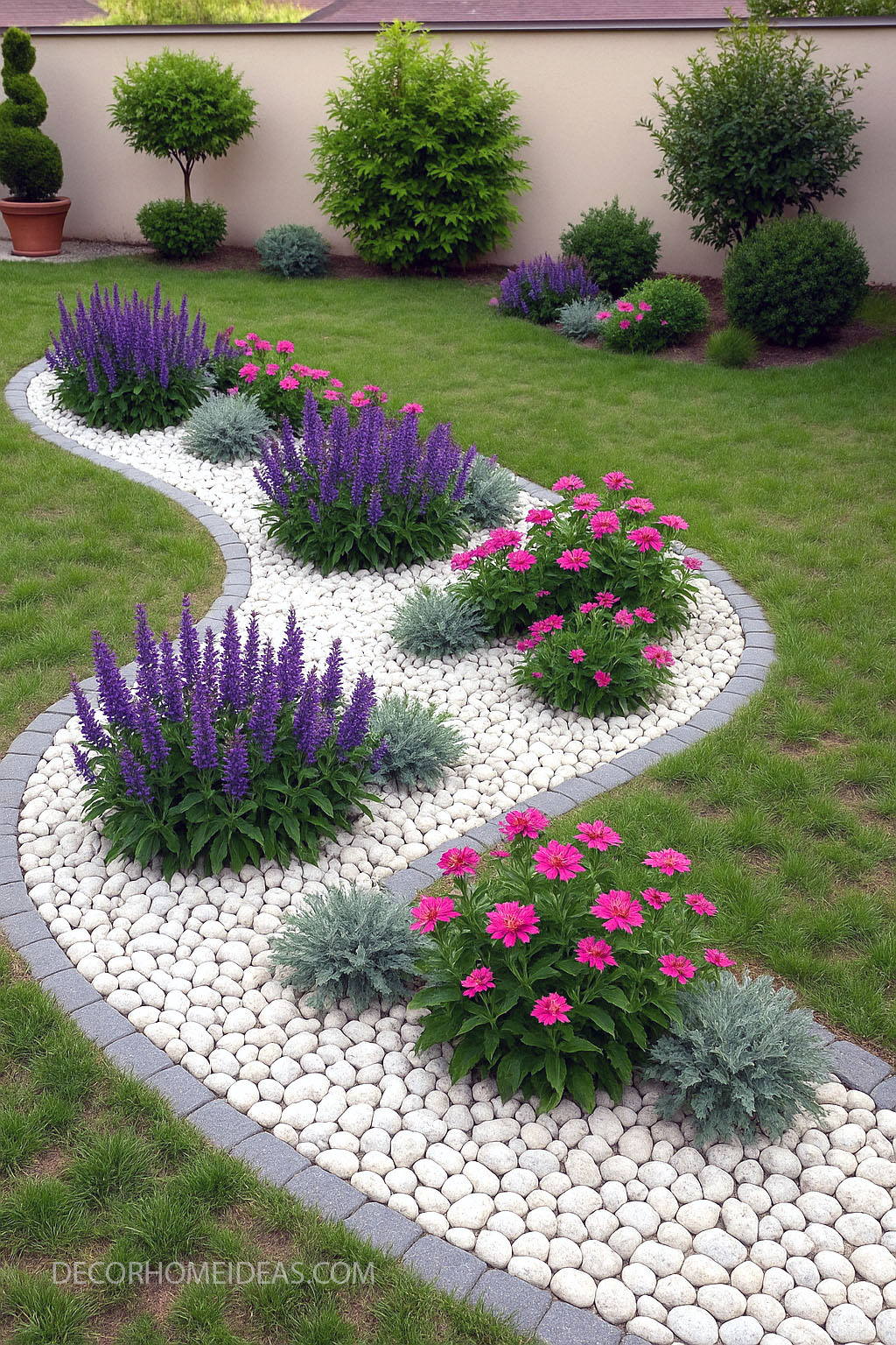 Stunning Flower Bed Design with White Pebbles & Lush Purple Pink Blooms